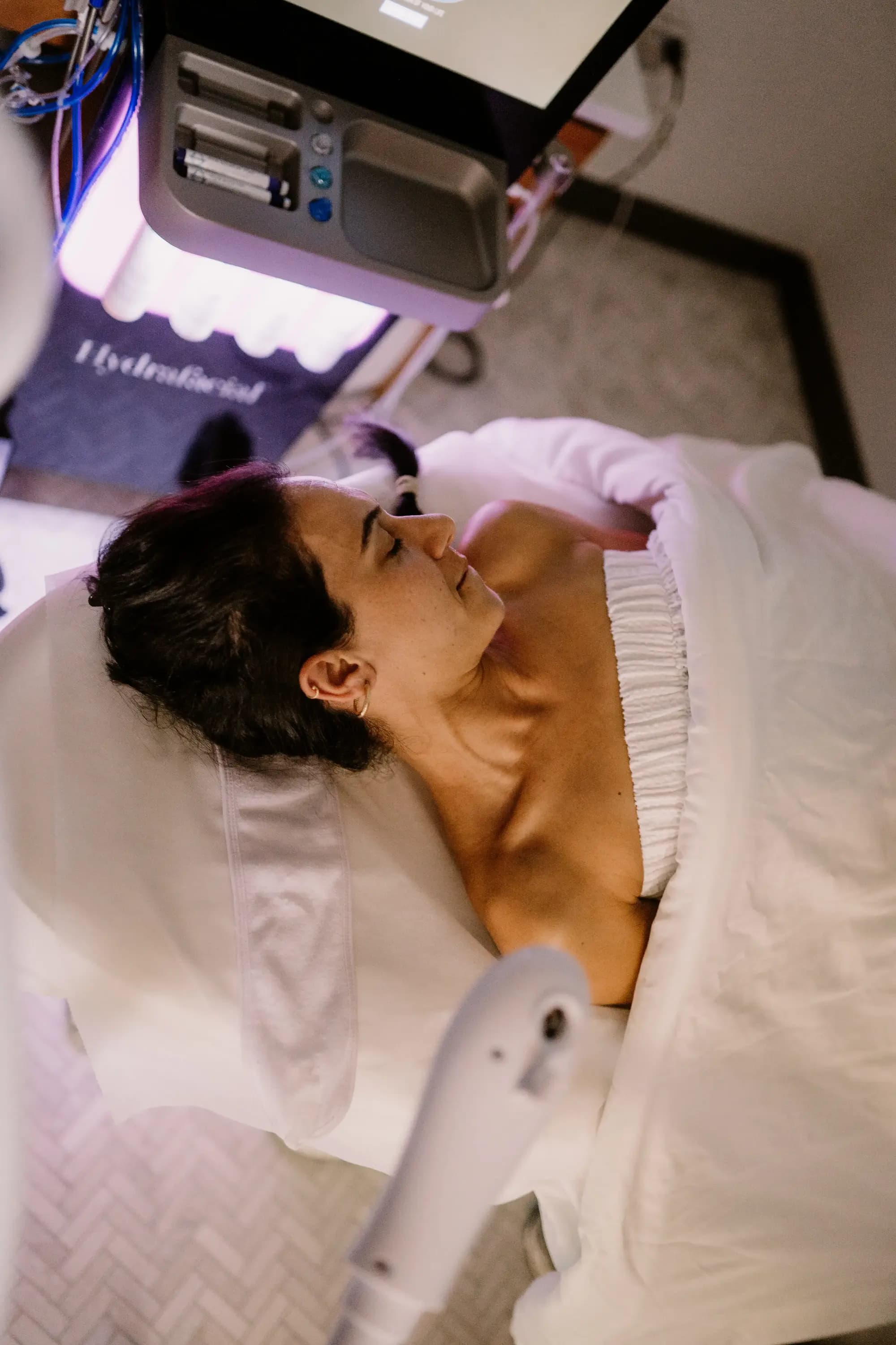 Close-up of a HydraFacial treatment in progress at Lift & Revive